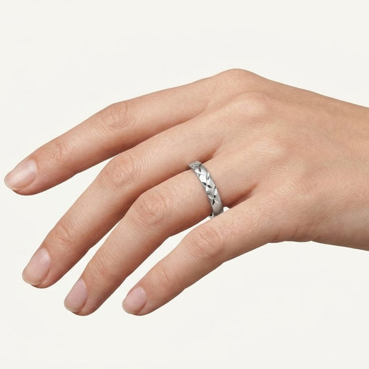 Elegant Silver Textured Band Ring with Geometric Cutout Design