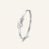Elegant Infinity Bow Bracelet – Silver Tone