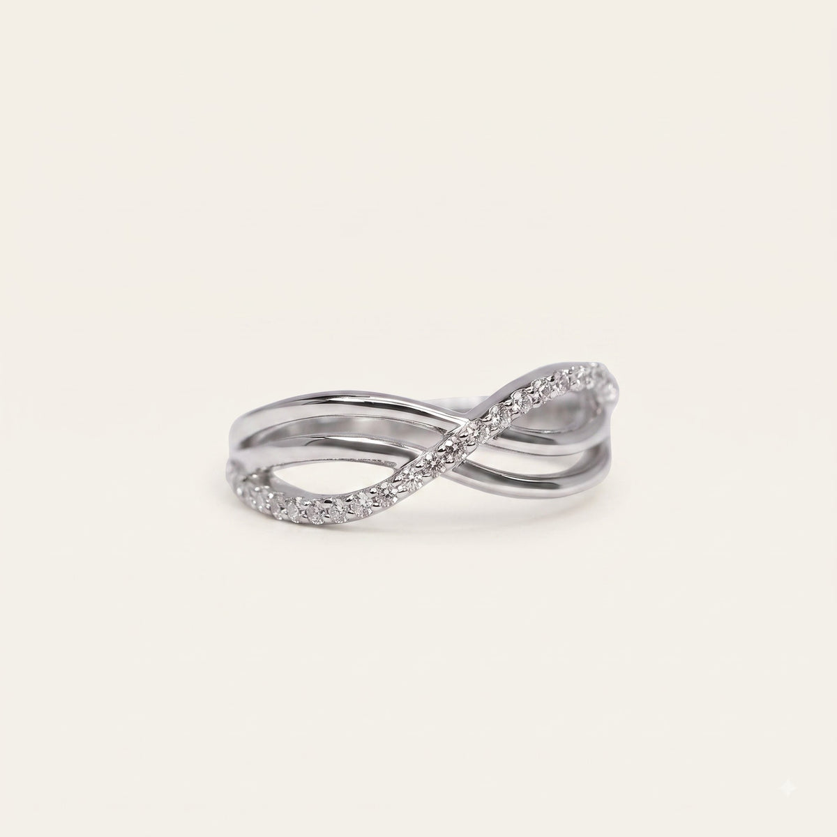 Elegant Silver Interwoven Pavé Ring with Curved Bands and Sparkling Detail