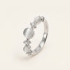 Elegant Silver Ring with White Cat Eye-Style Stones & Crystal Accents