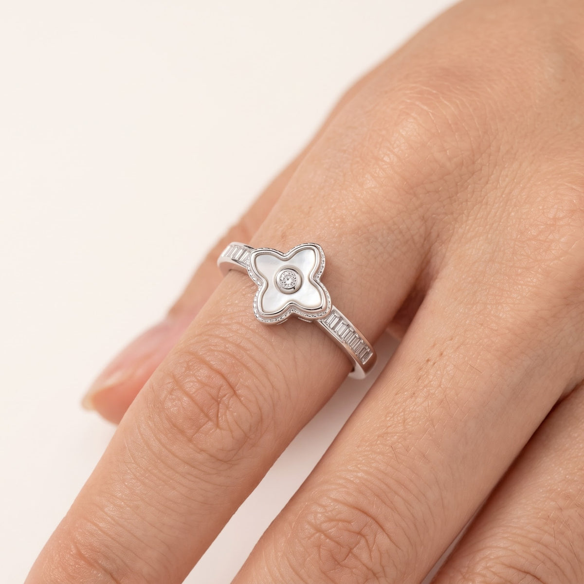 Elegant Silver Clover Ring with White Center Stone & Baguette Accents