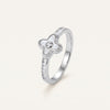 Elegant Silver Clover Ring with White Center Stone & Baguette Accents