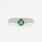 Elegant Green Emerald-Style Round Cluster Ring with Sparkling Stone Accents