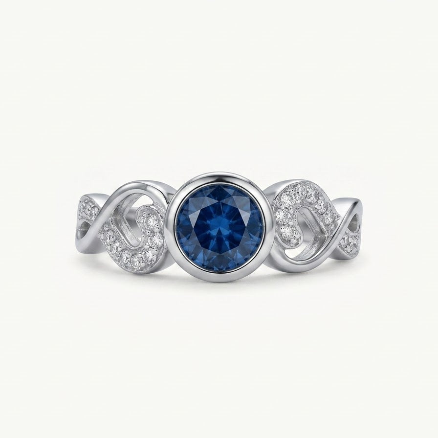 Elegant Blue Gemstone Heart Ring with Crystal Details – Silver Finish