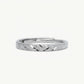 Elegant Silver Textured Band Ring with Geometric Cutout Design