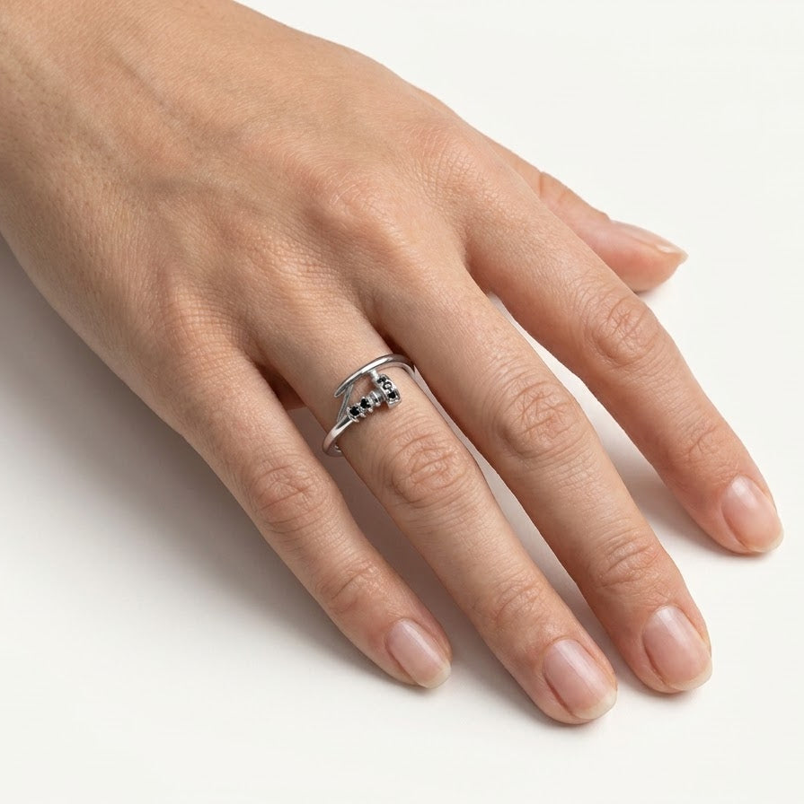 Elegant Silver Hook-Inspired Ring with Black Stone Accents