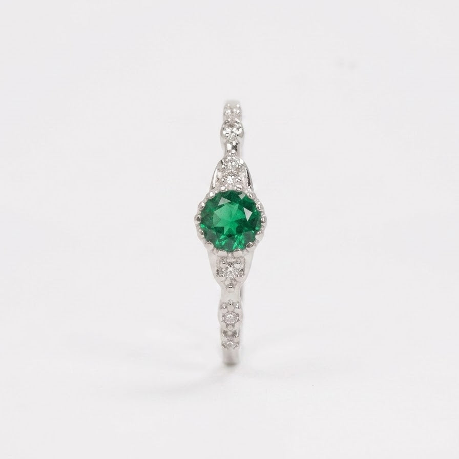 Elegant Green Emerald-Style Round Cluster Ring with Sparkling Stone Accents