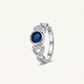 Elegant Blue Gemstone Heart Ring with Crystal Details – Silver Finish