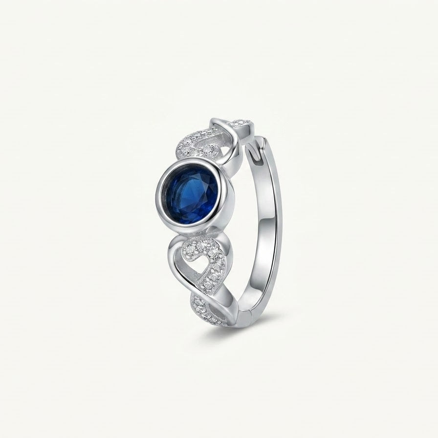 Elegant Blue Gemstone Heart Ring with Crystal Details – Silver Finish