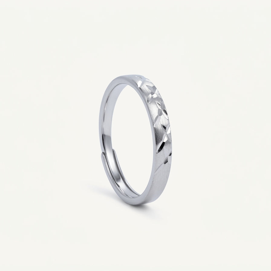Elegant Silver Textured Band Ring with Geometric Cutout Design
