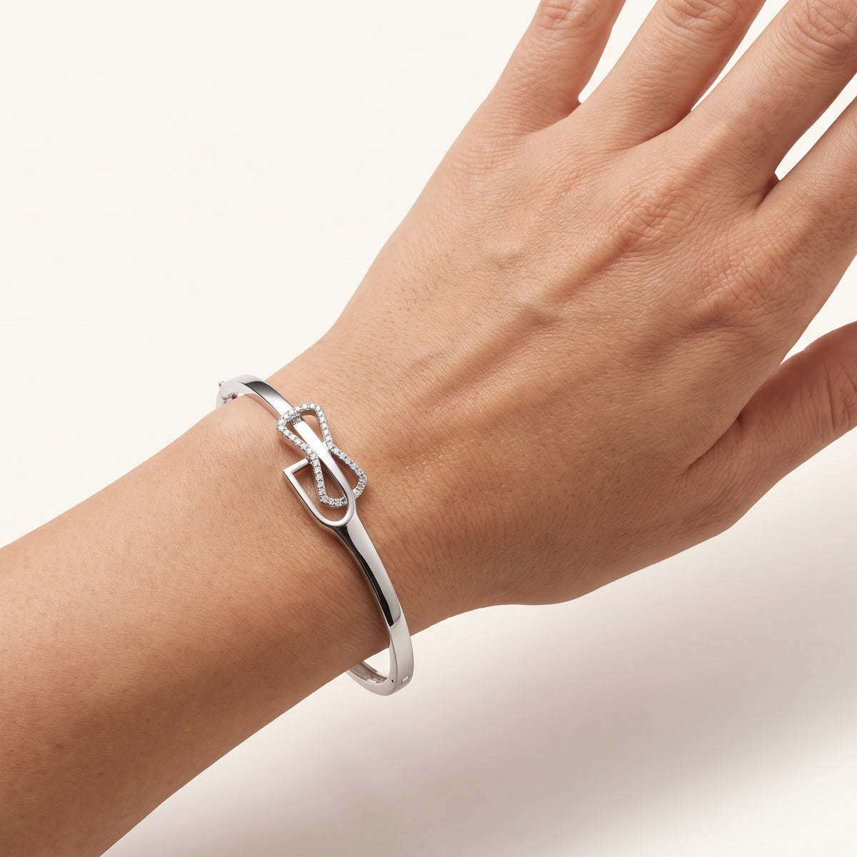 Elegant Infinity Bow Bracelet – Silver Tone