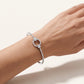 Oval Link Pavé Bangle Bracelet – Elegant Floral Crystal Centerpiece