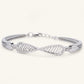 Infinity Twist Pavé Bracelet – Elegant Statement Bracelet