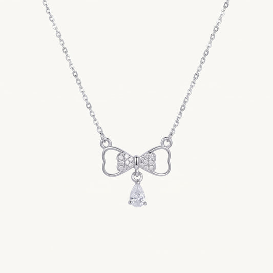 Elegant Silver Bow Necklace with Sparkling Teardrop Pendant
