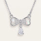 Elegant Silver Bow Necklace with Sparkling Teardrop Pendant