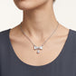 Elegant Silver Bow Necklace with Sparkling Teardrop Pendant