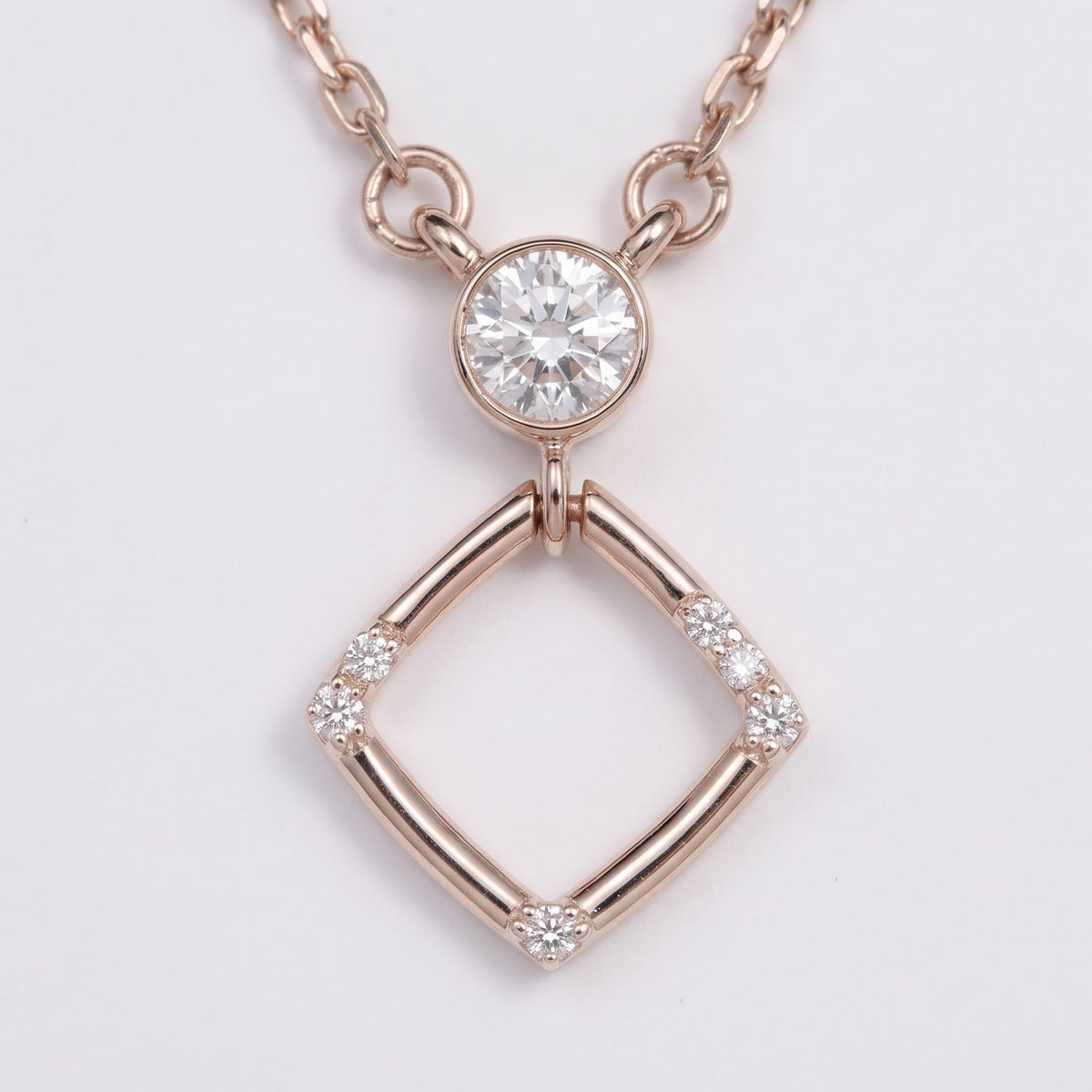 Rose Gold Geometric Pendant Necklace with Sparkling Round Stone