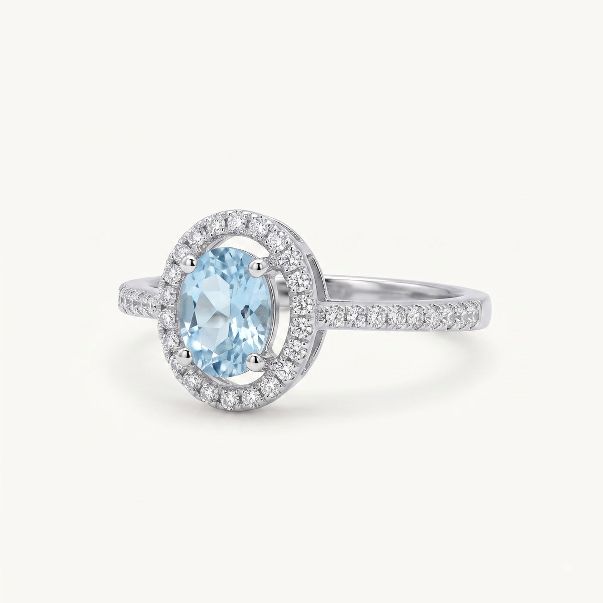 Elegant Blue Oval Gemstone Halo Ring with Sparkling Stone Accents