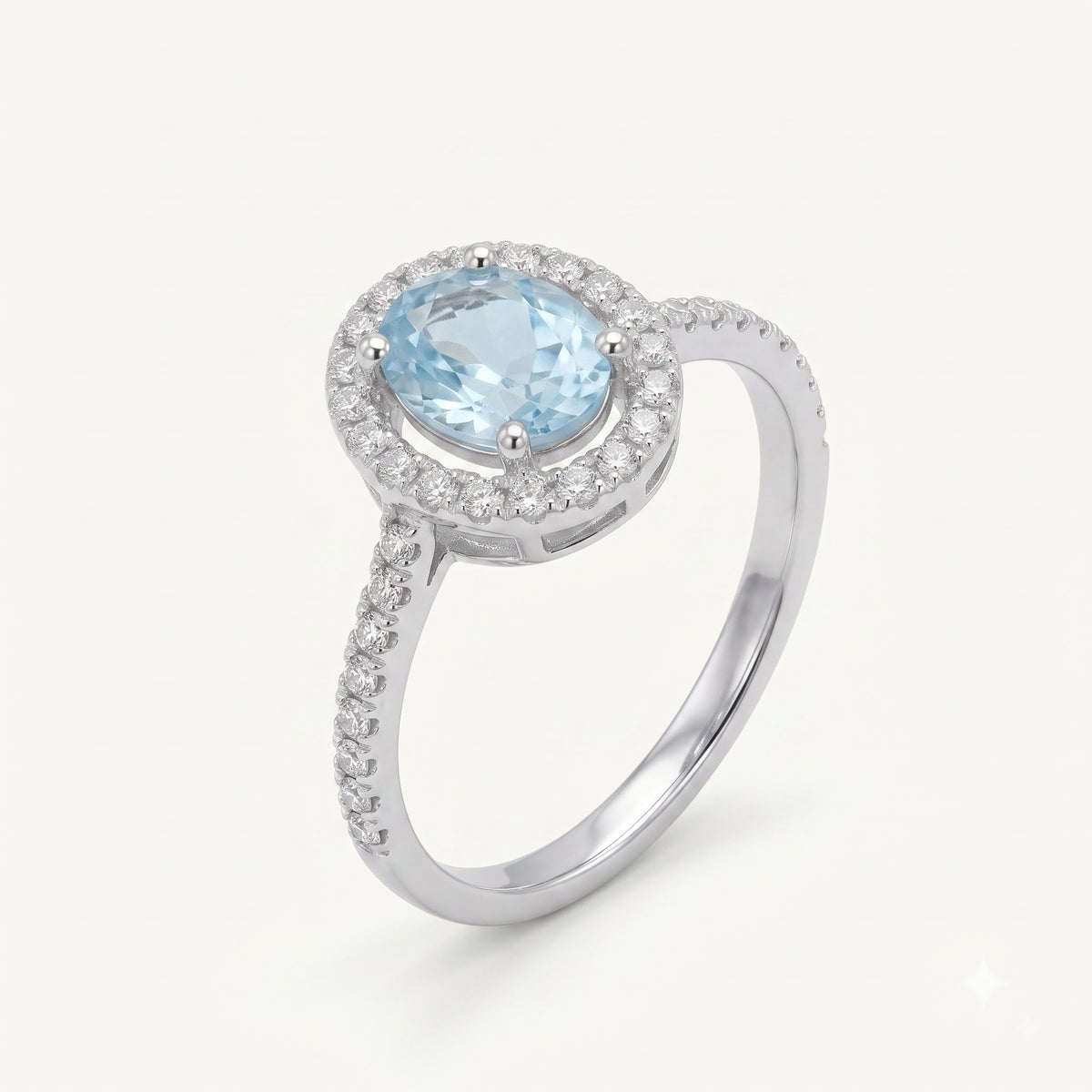 Elegant Blue Oval Gemstone Halo Ring with Sparkling Stone Accents