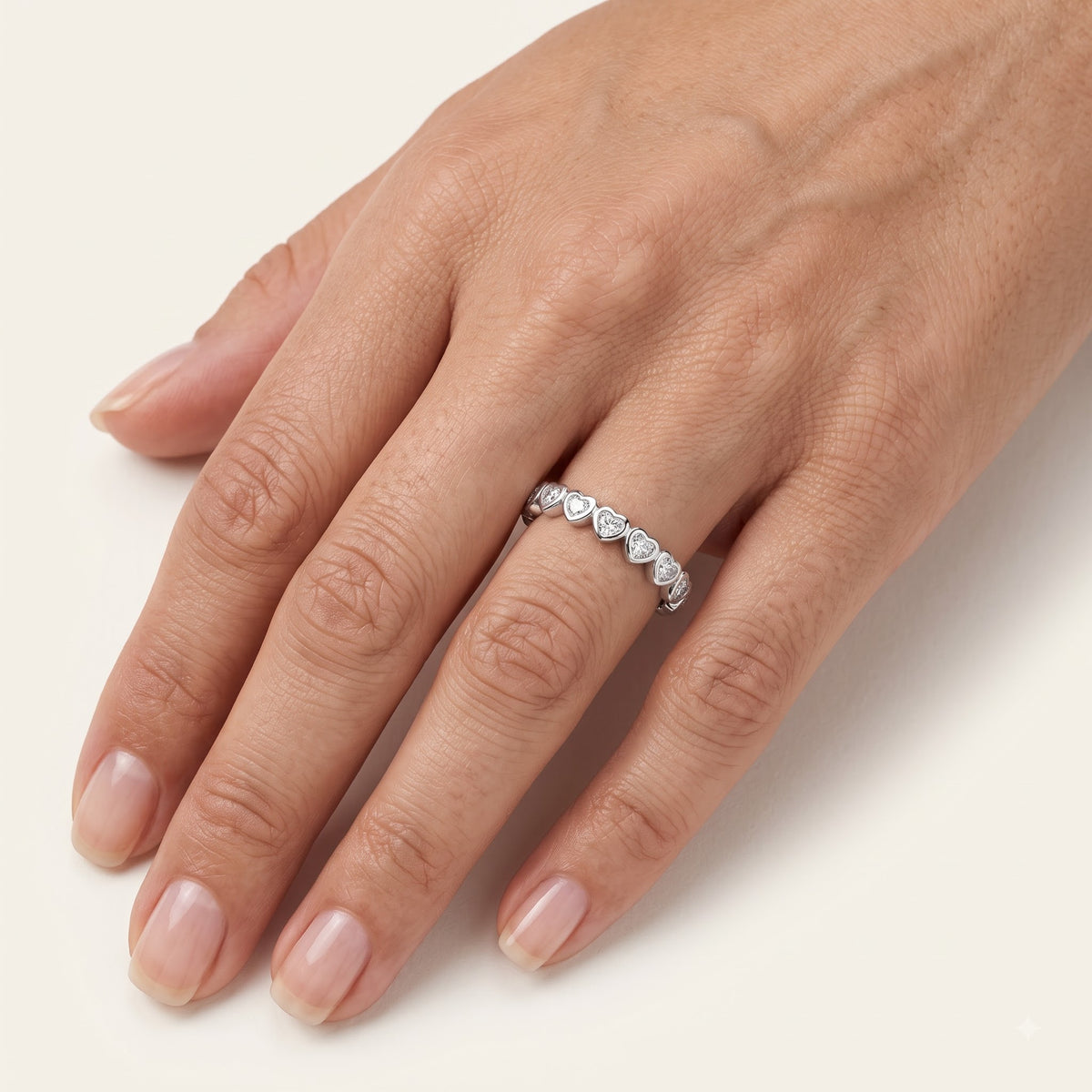 Elegant Heart-Shaped Stone Half Eternity Ring with Polished Silver-Tone Band