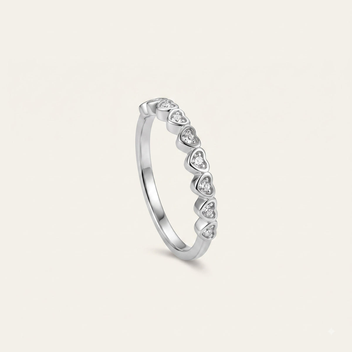 Elegant Heart-Shaped Stone Half Eternity Ring with Polished Silver-Tone Band