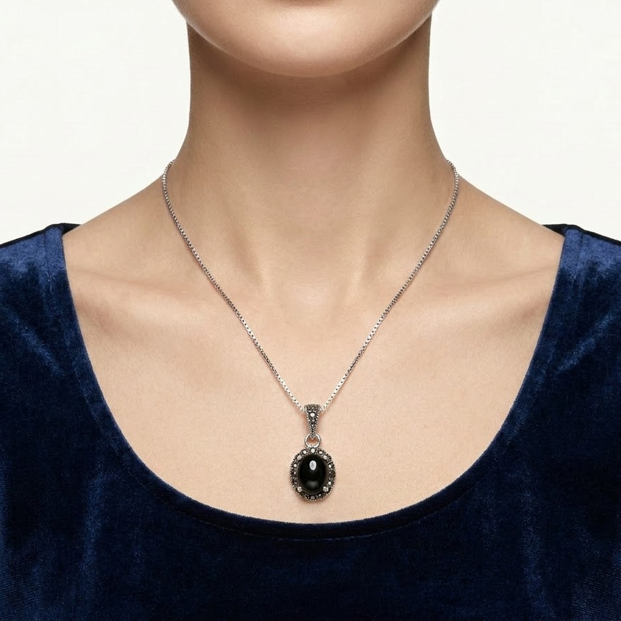 Black Oval Stone Pendant Necklace with Sparkling Silver Detailing
