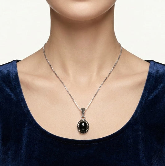 Black Oval Stone Pendant Necklace with Sparkling Silver Detailing