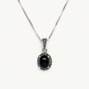 Black Oval Stone Pendant Necklace with Sparkling Silver Detailing